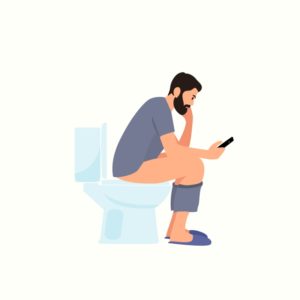 トイレに座って用を足す男性